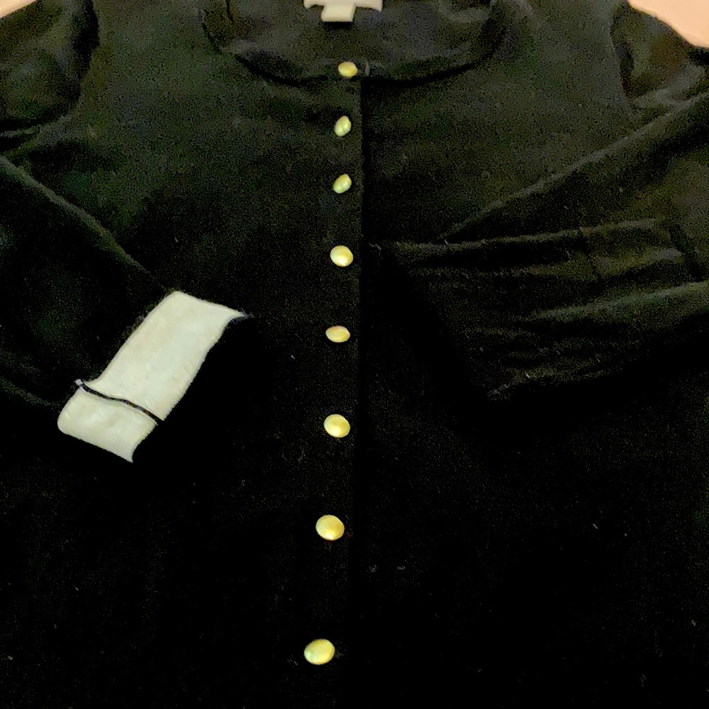 Black classic cardigan w/gold buttons & roll up cuff for contrasting color.